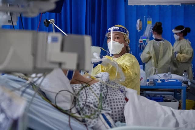 A nurse works on a patient in the ICU (Intensive Care Unit) in St George's Hospital in Tooting, south-west London, where the number of intensive care beds for the critically sick has had to be increased from 60 to 120, the vast majority of which are for coronavirus patients.
