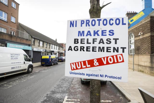 A sign by Unionists against NI Protocol on Main Street in Larne with the text