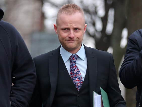 Jamie Bryson arrives Belfast Magistrates Court for a previous hearing