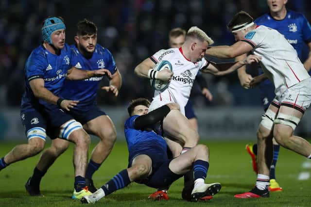 DUBLIN, IRELAND - NOVEMBER 27: Craig Gilroy of Ulster is tackled by Harry Byrne of Leinster during the match between Leinster v Ulster at RDS Arena on November 27, 2021 in Dublin, Ireland. (Photo by Oisin Keniry/Getty Images)