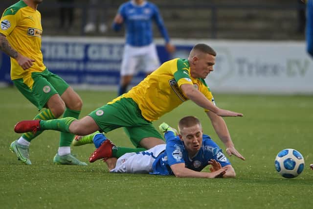 Cliftonville's Levi Ives tussles with Coleraine's Conor McKendry
