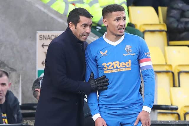 Rangers manager Giovanni van Bronckhorst gives instructions to James Tavernier