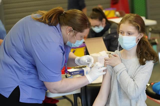 Nurse Amanda Sherwood administers a Covid-19 vaccine to Rachel McDowell (16) at the Just the Jab pop up vaccination centre at Kinspan Ulster Rugby Stadium in Belfast. Picture date: Saturday November 27, 2021.
