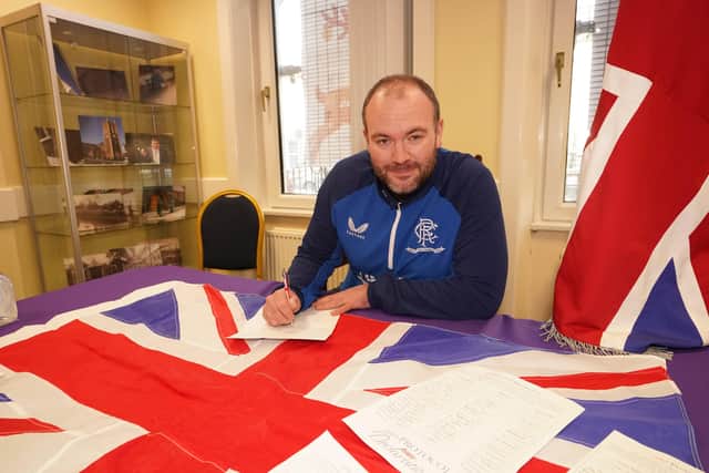 Alastair Power District Secretary of Portadown Orange Lodge signs a declaration in opposition to the Northern Ireland Protocol at Carlton Street Orange Hall. Picture date: Saturday November 27, 2021.