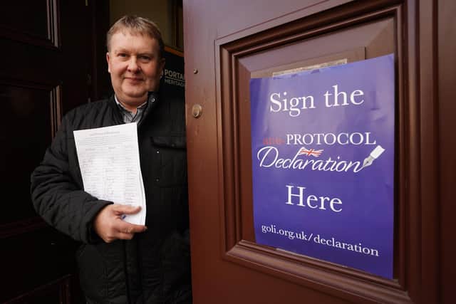 Harold Henning Deputy Grand Master of the Grand Orange Lodge of Ireland holds signed copies of declaration in opposition to the Northern Ireland Protocol at at Carlton Street Orange Hall in Portadown. Picture date: Saturday November 27, 2021.