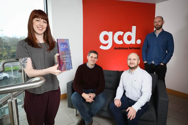 GCD Technologies marketing executive Melissa Devlin and head of design Greg Dalrymple alongside co-founders Andrew Cuthbert and Andrew Gough with their award for UK App Agency of the Year 2021