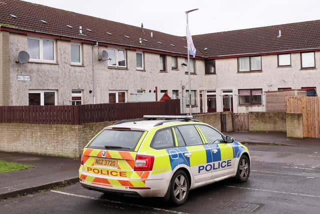 Police remain at the scene in the Elms Park area of Coleraine where two men died suddenly at a property on Monday. Picture by Jonathan Porter/PressEye