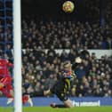 Liverpool's Mohamed Salah scores past Everton goalkeeper Jordan Pickford. Pic by PA.