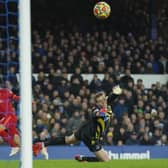 Liverpool's Mohamed Salah scores past Everton goalkeeper Jordan Pickford. Pic by PA.
