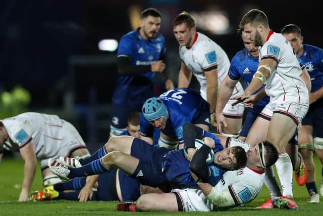 Luke McGrath of Leinster is tackled by Ulster's Marty Moore at RDS Arena on November 27, 2021 in Dublin, Ireland. (Photo by Oisin Keniry/Getty Images)