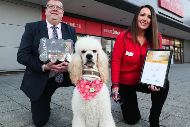 Mackles head of sales Colin Ferguson and Laura Hadden, regional manager of Jollyes with Rowan the dog