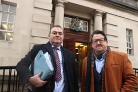 Sean Napier (right) and his solicitor Paul Farrell arrive at the Royal Courts of Justice in Belfast for a hearing in his legal challenge against the DUP's boycott of cross-border political meetings. Picture date: Tuesday December 7, 2021.