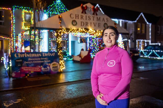 Emma Curran standing outside her home on Racecourse Drive in Derry. Emma and other residents of the street have recreated their annual 'Christmas Drive' to raise funds for local charities by transforming the street into a winter wonderland.