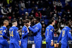 Scott Wright (3rdL) is congratulated by teammates after scoring during the Europa League football match at Olympique Lyonnais