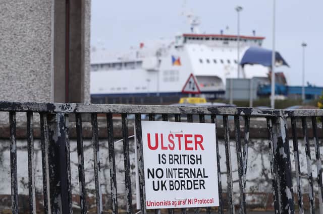 A sign protesting against the Northern Ireland Protocol in Larne Harbour, Northern Ireland. Picture date: Tuesday April 20, 2021.
