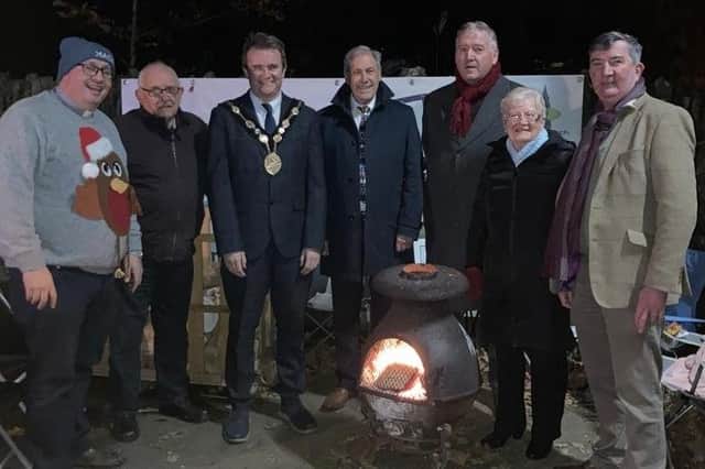 The annual 24 charity hour sit out by the Rev Willie Nixon of St Patrick's Church of Ireland Drumbeg, from 8pm on Sunday December 12 2021 to 8pm on Monday December 13. Pictured from left Rev Nixon, Hugh Crookshanks (Church Vestry), Mayor Stephen Martin, Councillor Alex Swan, Councillor Uel Mackin,  Audrey Jackson (Drumbeg Community Association), Councillor James Baird