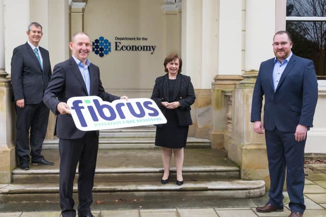 DAERA Minister Edwin Poots, Fibrus chair Conal Henry, then-economy minister Diane Dodds and Fibrus CEO Dominic Kearns after the contract was awarded