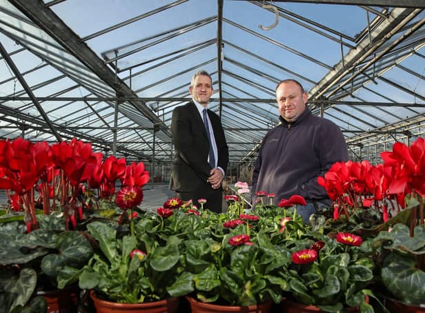 Ulster Bank business development manager Paul Reid pictured with Wilderness Flower & Garden Centre owner Kyle Archer