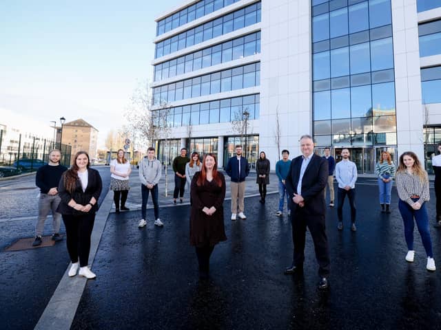 Talent and acquisition Consultant at Allstate NI Shannon Ellis and VP and managing director of Allstate NI John Healy pictured with recent recruits to graduate roles within the company