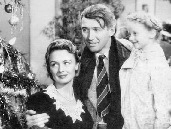 James Stewart as George Bailey in ‘It’s A Wonderful Life’ with  Donna Reed who played his wife Mary and Karolyn Grimes who played their youngest daughter  Zuzu. Stewart was nominated for an Oscar for his role and although he didn’t win the film acted as a springboard for the rest of his career