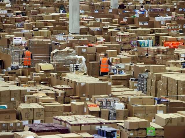 Staff at the Amazon Swansea fulfilment centre process orders for Christmas.