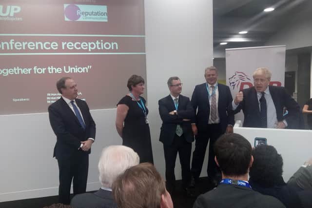 Nigel Dodds MP, Arlene Foster MLA and Sir Jeffrey Donaldson MP listen to the prime minister, Boris Johnson, addressing the DUP drinks reception at the Conservative Party conference on Tuesday October 1 2019. The next day the prime minister unveiled a Brexit plan that included a regulatory border, which the DUP initially supported subject to Stormont pre approval