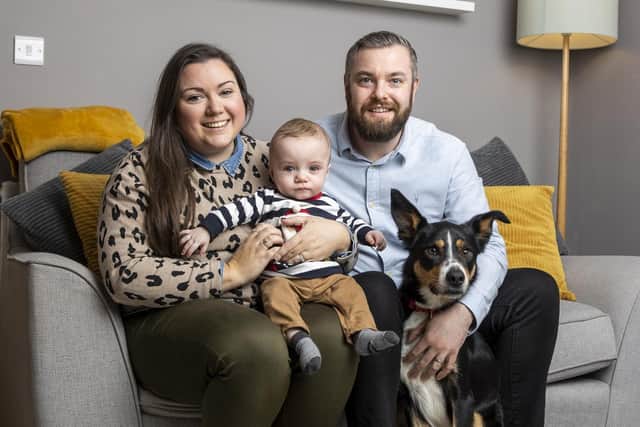 Martin and Gillian Johnston with their son Robert 'Robbie' Johnston and their rescue dog Max at their home in Ballyclare
