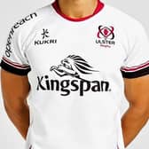 An Ulster Rugby top, bearing Kingspan’s name and logo