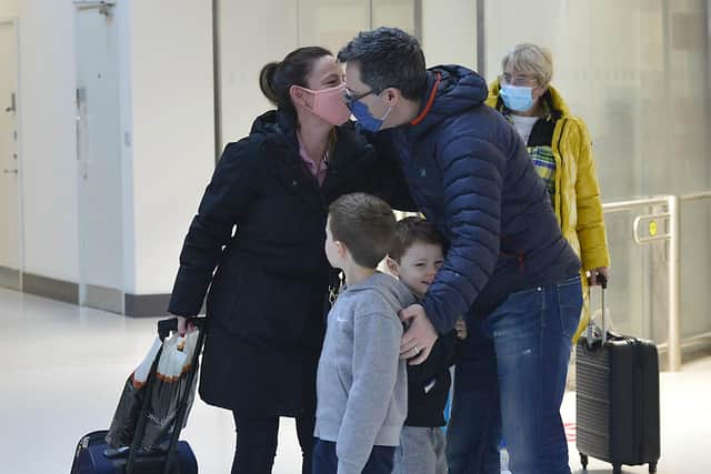 Richard Hassan and his two sons Liam, 8 years old, and Kyle, 6, from Jordanstown pictured welcoming home mom Suzi to George Best Belfast City airport. Picture By: Arthur Allison/Pacemaker Press.