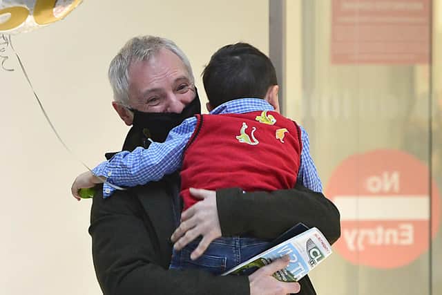 The Adams family: Wee Archie from Armagh pictured welcoming home his Granda Cliff from Aberdeen on his 60th birthday to George Best Belfast City Airport. Picture By: Arthur Allison/Pacemaker Press.