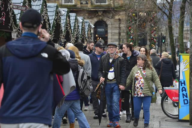 Crowds of shoppers on Donegall Square North, alongside the now shut Christmas Market, on December 23. 
Picture by Arthur Allison/Pacemaker Press