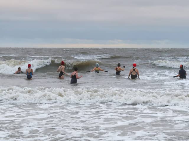 The swimmers head out into Belfast Lough from Helen's Bay beach in Co Down for their annual Christmas Day plunge.

Photograph by Declan Roughan / Press Eye