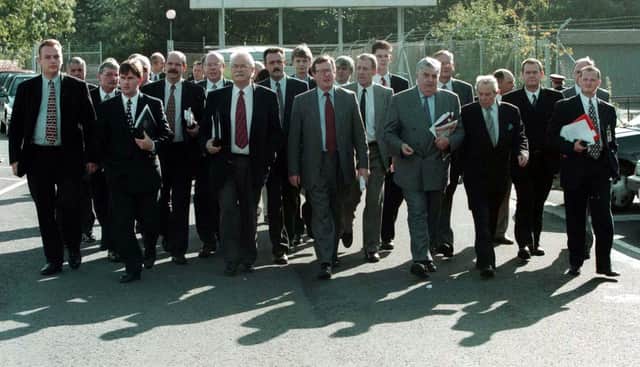 The then Ulster Unionist Party leader, David Trimble (centre), arriving with delegates from the UUP, the Progressive Unionists and the Ulster Democratic Party at Castle Buildings, Stormont, where they rejoined the Northern Ireland peace talks process.