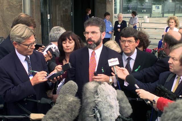 Then Sinn Fein president Gerry Adams speaking to the media before going into Belfast's Waterfront Hall. Memos directed staff on how they were to engage with Sinn Fein after the party committed itself to the Mitchell principles, according to newly released documents from the National Archives.