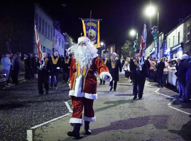 Members of the Orange Order along with local bandsmen take part in a Christmas themed procession through Markethill
