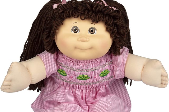 The original Cabbage Patch Kid, arms outstretched for a huge hug