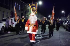Santa Claus at the head of the Orange Order parade in Markethill, Co Armagh on Wednesday night. Photo: Kelvin Boyes / Press Eye.