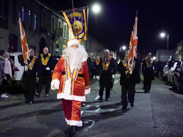 Santa Claus at the head of the Orange Order parade in Markethill, Co Armagh on Wednesday night. 

Photo: Kelvin Boyes / Press Eye.
