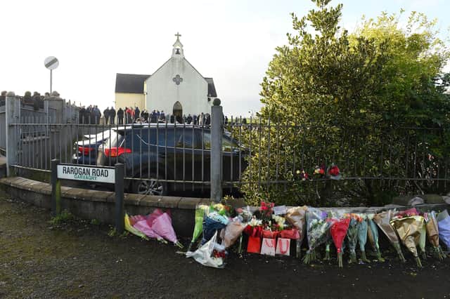 Flowers left at the scene of the road accident close to the funeral service for Nathan Corrigan, 20,  at St Matthew's Church, Garvaghy, Co Tyrone. Photo: Oliver McVeigh/PA Wire