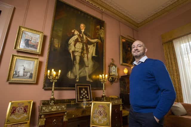 Dr Christopher Warleigh-Lack, National Trust property curator for east Down based at Mount Stewart, the family home of Robert Stewart, better known as Lord Castlereagh stands beside a portrait of Robert Stewart, by Sir Thomas Lawrence. Photo: Liam McBurney/PA Wire