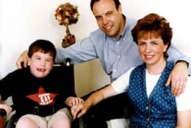 Andrew Dodds, who died in 1998, pictured with his parents Nigel and Diane Dodds