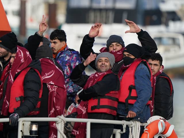 A group of people thought to be migrants are brought in to Dover, Kent, by the RNLI following a small boat incident in the Channel. Picture date: Tuesday January 4, 2022. PA Photo.