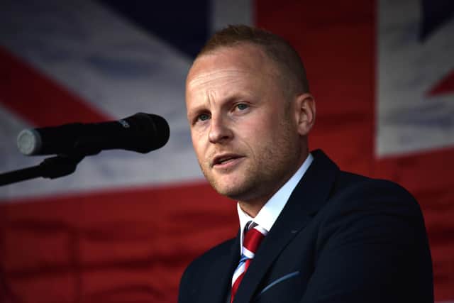 Jamie Bryson is editor of Unionist Voice. He calls on Minister Poots to bring a paper to the executive seeking permission for the checks. Every unionist must oppose such, he says