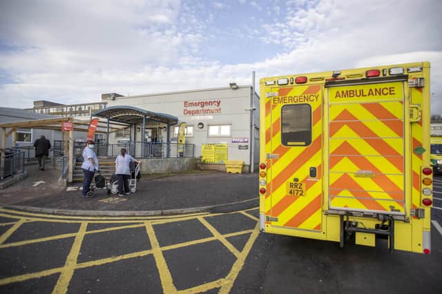Ambulance parked outside main entrance to the Emergency Department of Dundonald Hospital in Belfast, Northern Ireland.