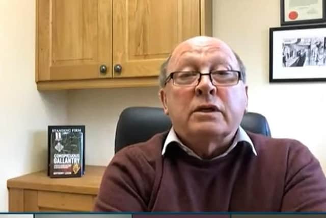 Sinn Fein has complained about TUV leader Jim Allister having a book on the UDR clearly visible in the background during a video call with the Stormont Finance Committee.