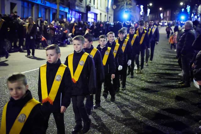 Members of the Orange Order along with local bandsmen take part in a procession through Markethill village, Co Armagh to mark the end of Northern Ireland's centenary year.Photo by Kelvin Boyes / Press Eye