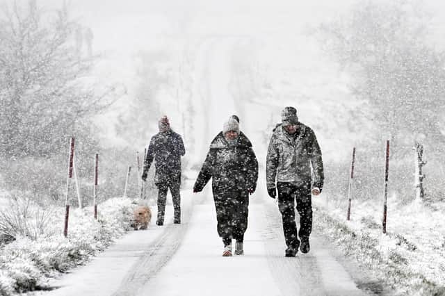 Walkers  on Divis Mountain on Friday morning as many parts of Northern Ireland were hit by snow. 



Pic Colm Lenaghan/ Pacemaker