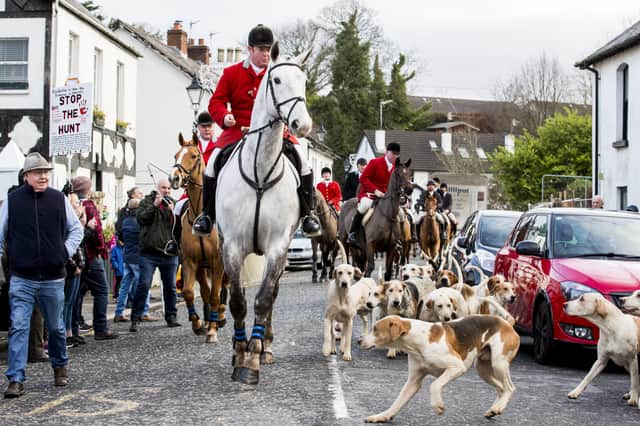 The Huntsman Master leads the hounds and riders through Main Street Crawfordsburn during the the North Down New Year Hunt in 2019. Photo: Liam McBurney/PA