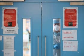Infection Control nurse Colin Clarke looks out from a Covid-19 recovery ward at Craigavon Area Hospital in Co Armagh, Northern Ireland.