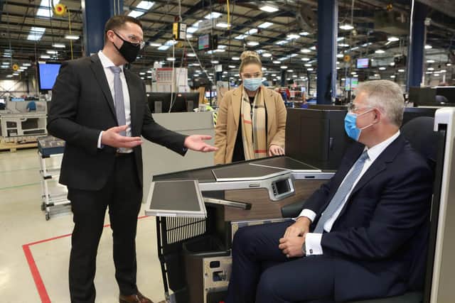The Secretary of State for Northern Ireland, Brandon Lewis MP with the SOSNI is managing director, Stuart McKee and Nadine Hewitt, business unit director at Collins Aerospace in Kilkeel